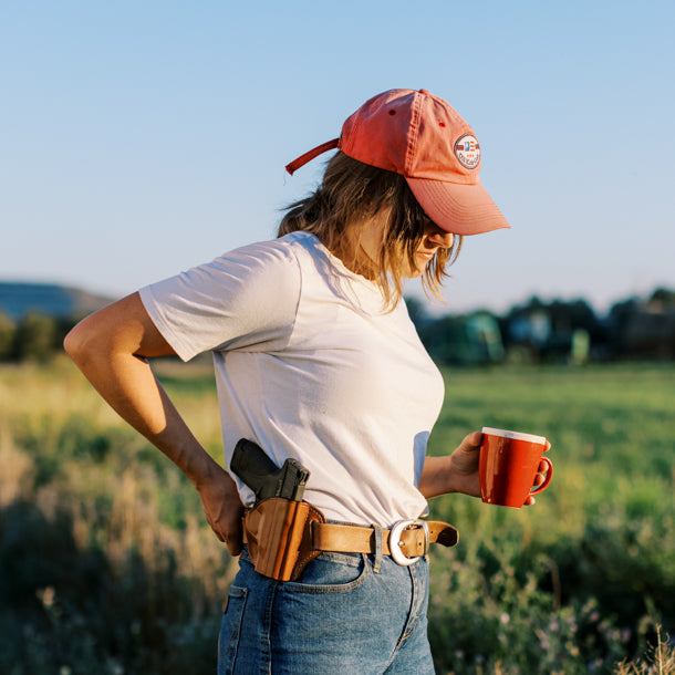 woman wearing leather outside waistband holster